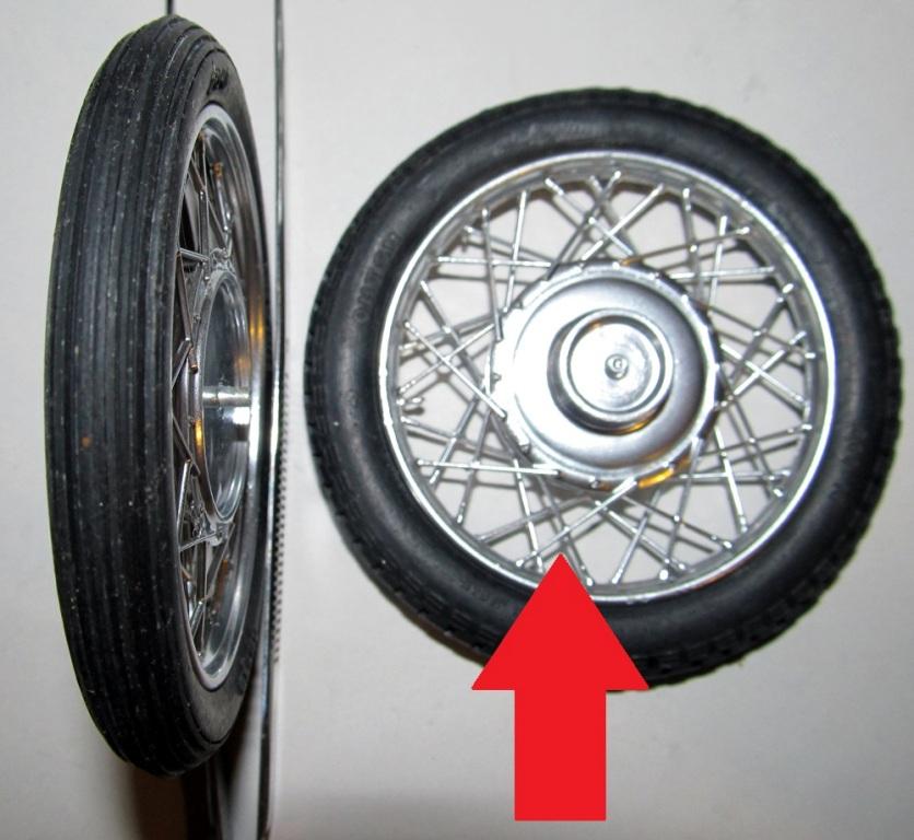 PIC 21 Insert the proper rim into one side of both the front and rear tire. Add the proper opposite side to the tire.