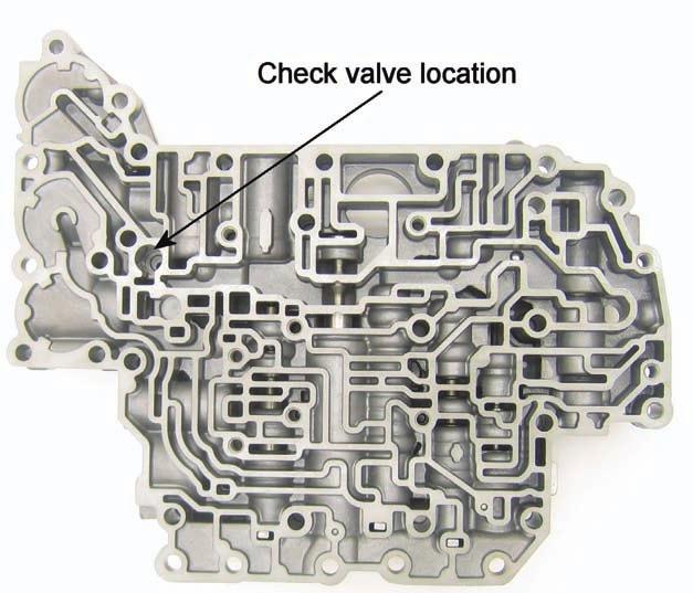 Figure 13 shows the check valve location spring first then valve. Figure 14 accumulator piston and spring identification and locations.