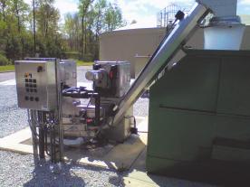 At the top of the unit, a hot-water spray washes the solids into the screenings washer and compactor.
