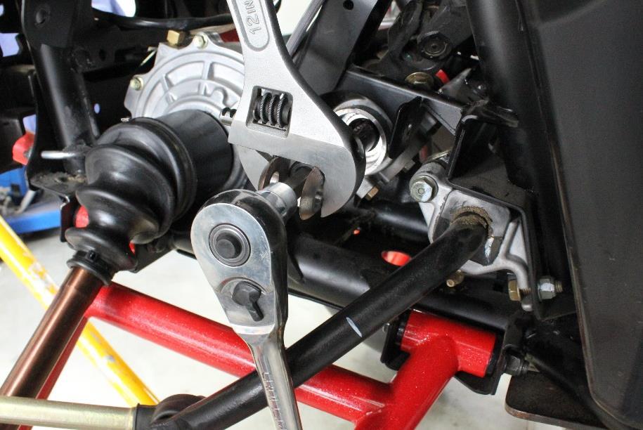 Figure 2: installing clevis to the steering rack bar Figure 3: trim the small end off the dust boots, so it can be attached to the clevis groove. 6.
