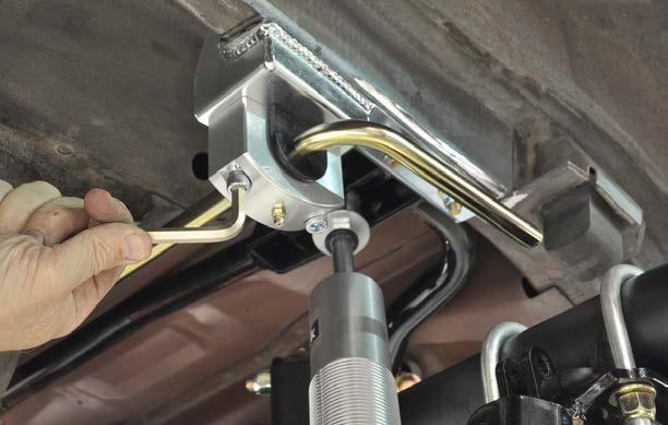 5. Use a 3/8-16 tap to chase the threads in the anti-roll bar frame mounts. 6.