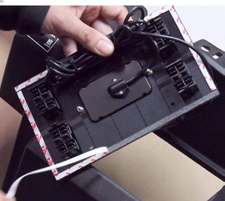 Peel off the double sided stick from the back of the dash kit panel. C.