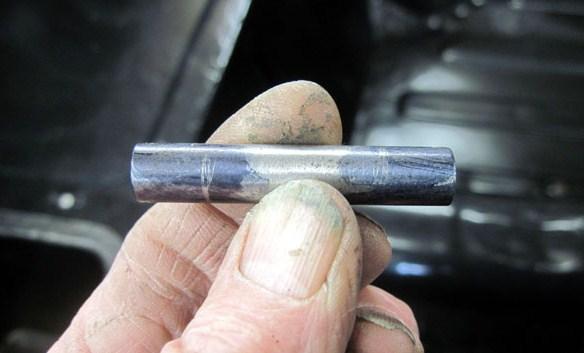 The spacers were then pushed through the plastic bottom of the battery box. The spacer tube marked for the two spacers required.
