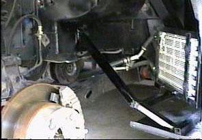 Mounting Body The rear wheel wells can be secured to the body by running a brace from the tube that was glassed in the rocker panel to the