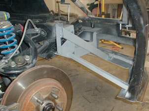 Mounting Body Drivers side Skid plate Brace from Fiero frame to skid plate Passenger side Skid plate FIGURE 104.