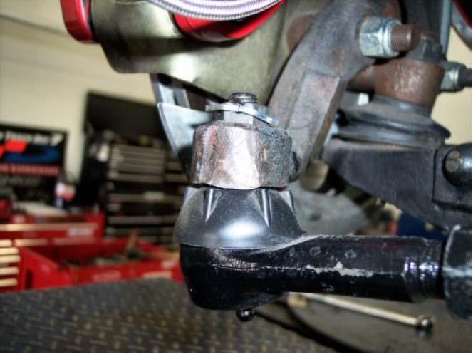 6. Disconnect the Outer Tie Rod Ends Locate the outer tie rod end and