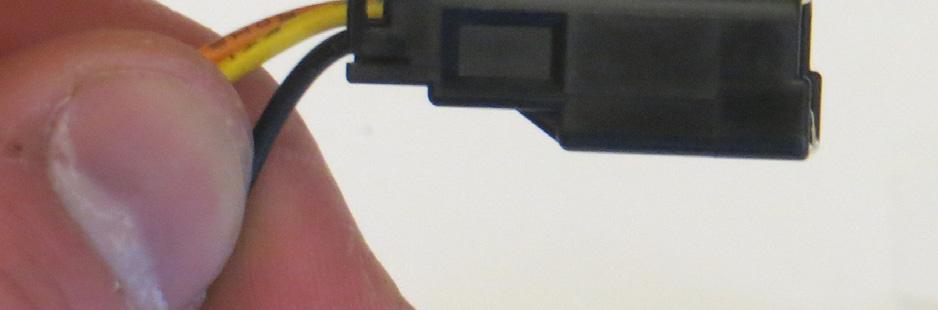 Insert the yellow, orange, and black wire terminals as shown. The terminals should lightly click into place in the connector.