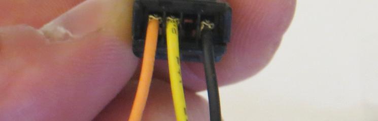 Connect the Gauge connector to the main harness connector; secure the wiring in the retaining clip on the underside of the tank.