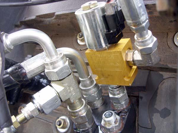 Installation Procedure 6. Install the solenoid valves on the right and left steer lines that exit the Orbitrol.