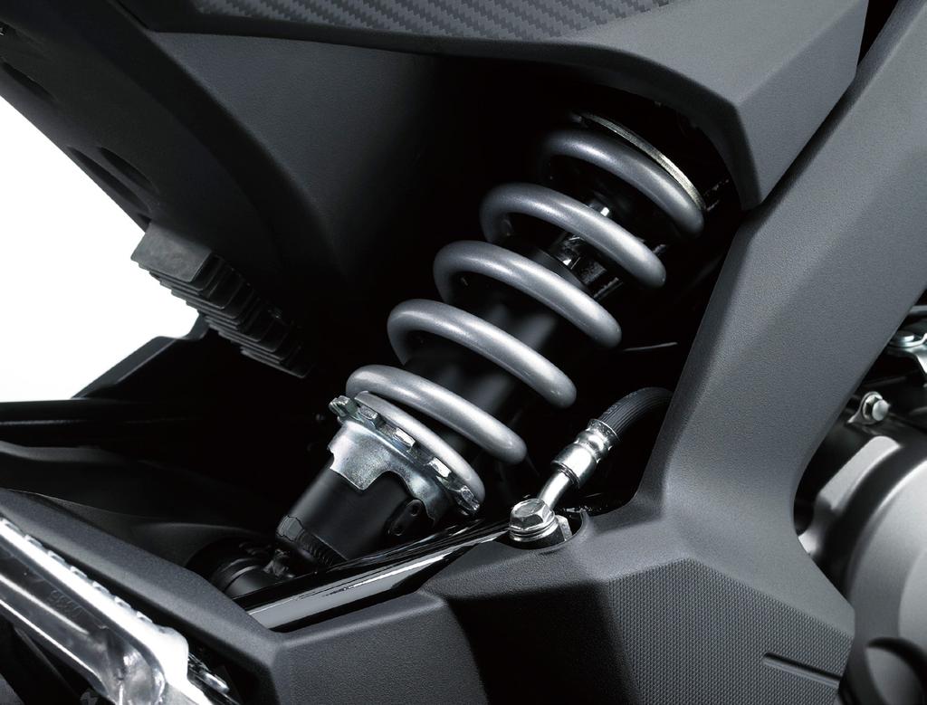 (Photo 11) 11 12 Offset laydown rear suspension enables a compact package while contributing to sporty handling.