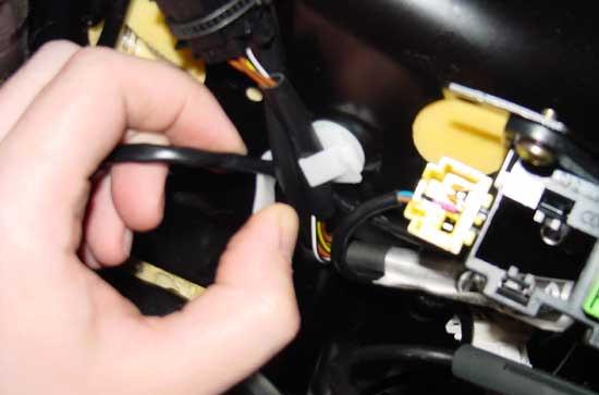 At the end of the wire is a black (or yellow if your car is newer than 2002) plug.