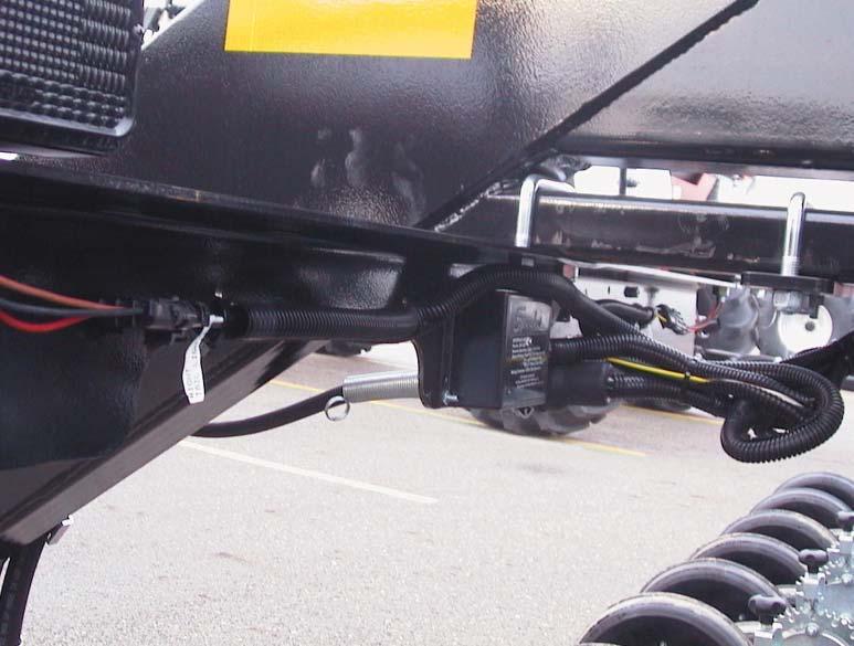 Bracket attaches with u-bolt to rear hitch. Note the light and decal placement.