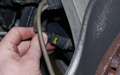 REMOVING THE ORIGINAL FRONT BRAKES Step 3: Flat Blade Screwdriver On the LH (drivers) side of the vehicle only, remove the brake pad warning sensor connector from it s bracket by first gently