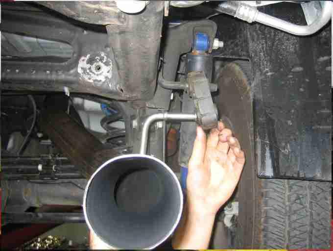 Insert the pipe over the muffler exit and