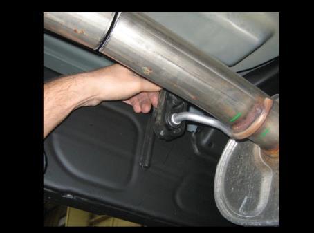 Remove the grommets from the tailpipe hangers at the