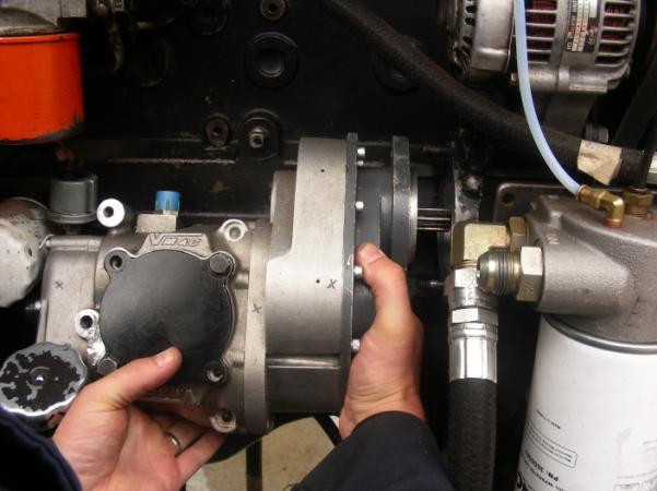 Figure 5.4 Installing the compressor 5.6 Secure compressor to the engine using the two M10 nuts provided.