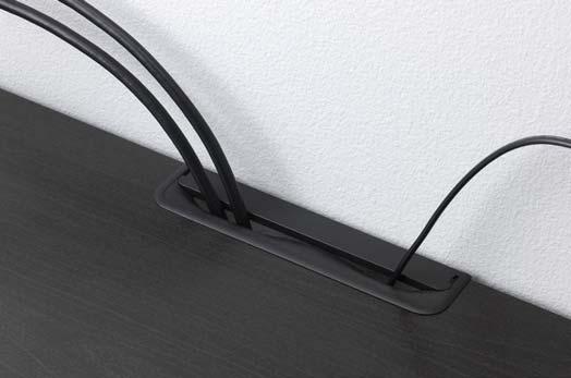 Outlets at the back of the TV bench keep them out of sight but simple to