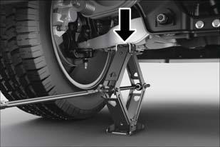3. Placement of the jack is critical: Keep the jack and tools aligned while raising the vehicle 1500 Series Trucks (4x2 And 4x4) When changing a front wheel, place the scissors jack under the rear