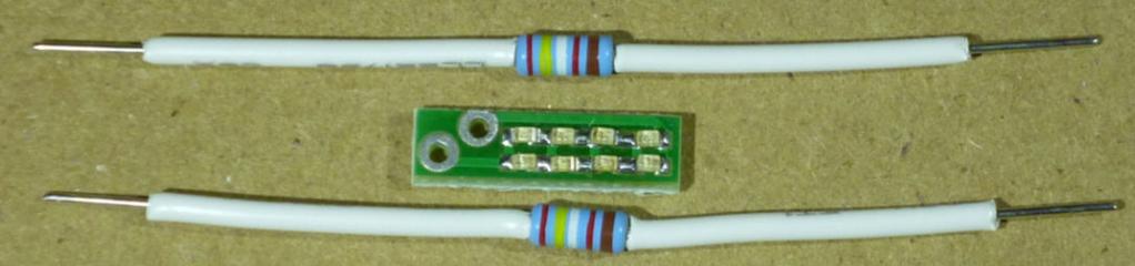 Figure 1-Blue LED PCB comes with 8 Blue LEDs pre-installed 1. Do not cut the resistor leads. Leave them full length. 2. Strip the supplied 22 AWG white wire to remove 4 pieces of insulation.