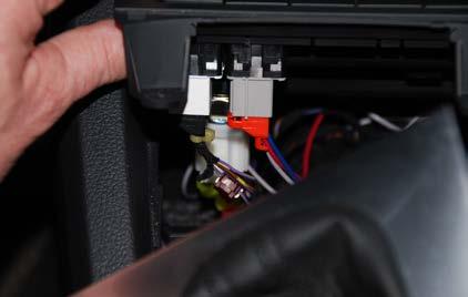 Step 36: Push the new Traction Control switch into place next to the start button.