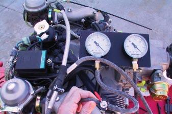 Adjust the two in-line valves to stabilize the vacuum gauge needles as shown in Photo 2.