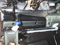 On the driver side, using a 14MM socket, remove the four (4) bolts
