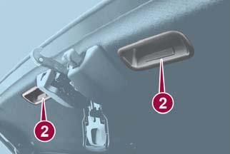 GETTING TO KNOW YOUR VEHICLE 3. Standing outside of the vehicle, hold the convertible top along the front edge and pull it towards the vehicle front.