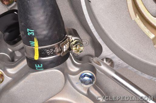 Install the hose clamp and tighten it securely with a #2 Phillips screwdriver. Fill the engine oil.