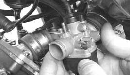 STRIPPING DOWN THE CARBURETTOR - Slacken off the carburettor - inlet manifold and