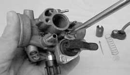 - Remove the piston valve - cold start system (choke) securing