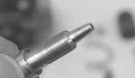 - Replace the doser conical needle if any signs of damage are observed on its circumference, as shown in the figure.