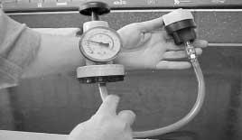 - In order to check the correct operation of the expansion reservoir cap overpressure valve, use a manometer with an appropriate adapter for