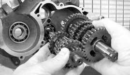 beside the crankcase in the right hand side crankcase half, and withdraw the crankshaft.