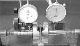 - Using a dial comparator gauge, determine the connecting rod big end bearing play in the X and Y axes. Service limit: 0.05 mm.