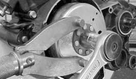 STRIPPING DOWN THE MAGNETO ALTERNATOR - Remove the gear shift lever and the magneto alternator cover,