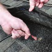 Lift the marked shingle tab Figure 14 and drill a ⅜ hole. See figure 16. DO NOT DRILL THROUGH RAFTER.