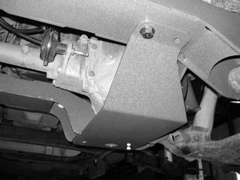 Attach the "wing" of the passenger's side differential bracket to the back of the control arm pocket. There is an existing hole in the pocket that will line up with the mount hole in the "wing".