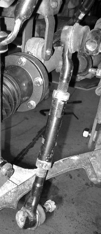 Figure 17 50. Mark and cut 3/8" off of the outer end of the tie rod end adjusting sleeve. This will match the amount removed from the tie rod end.