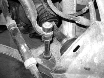 10. Pull the torsion bars rearward from the lower control arms and out of the vehicle. 11.