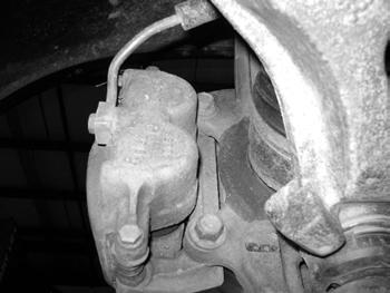 Figure 6 17. Remove the brake rotors and save. Remove the brake dust shield. 18. Remove the front axle shaft cotter pin, axle nut retainer and axle nut. Figure 7 Save hardware.