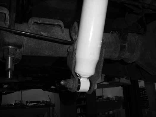 The factory block will not be reused. 7. Lower the axle just enough to install the new provided 5" lift block between the axle and the spring.