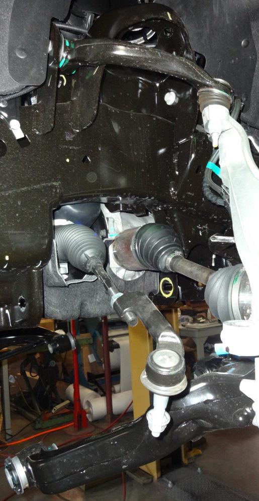 LOWER THE JACK SLIGHTLY UNDER THE LOWER CONTROL ARM, REMOVE THE UPPER OUTER THREE STRUT TO FRAME NUTS AND REMOVE THE STRUT ASSEMBLY FROM THE VEHICLE, SAVE
