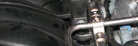 Use a 10mm deep socket to remove the five studs retaining each of the ignition coil brackets to the