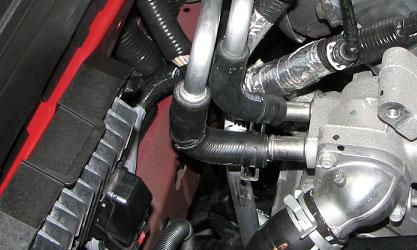 Install the supplied Heater Core Hose Assembly to the firewall fittings using the supplied hose clamps.