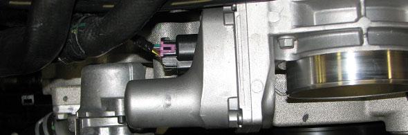 Use a 3/8 Fuel Line Removal Tool to disconnect the fuel line from the fuel rails and from the passenger side