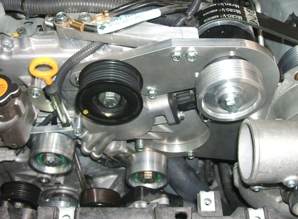 6. Install the inlet boot into the hole from the engine compartment. Just leave it loose in there for now. (photo 45) 7. Lower the blower assembly into the car.