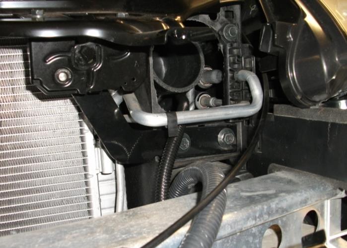 You will need to move it around in order to line up the hole on the hood latch. (Photo 61) 2.