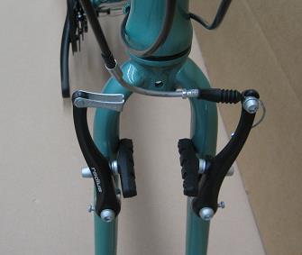 3. FRONT WHEEL INSTALLATION If the brake cable is connected (3-B), disconnect by holding the brake arms together and removing the silver insert from the cable stop.