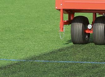 The rotating brush roller tosses the sand or the granules accurately downward onto the turf pile.