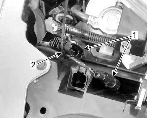 PARTSTOBEINSTALLED 37. Install the PTS connector retaining clip on the front frame. rbl2014-004-012_a RH CONNECTORS 1. Connectors 2.